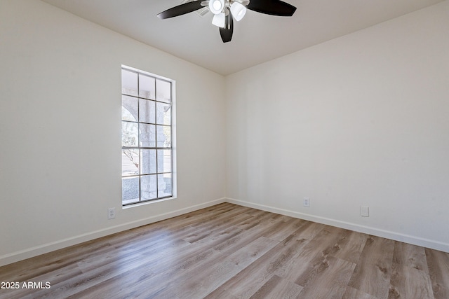 unfurnished room with ceiling fan and light wood-type flooring