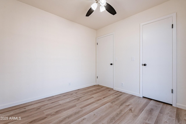 unfurnished bedroom featuring light hardwood / wood-style flooring and ceiling fan