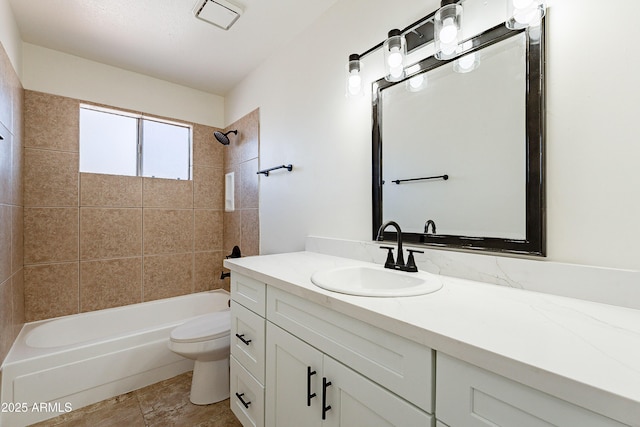 full bathroom with tiled shower / bath combo, toilet, and vanity