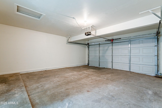 garage featuring a garage door opener