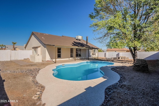 view of pool featuring a patio area and central AC unit