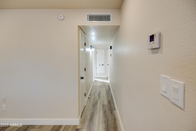 hall featuring light hardwood / wood-style flooring