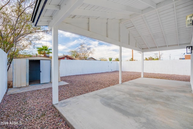 view of patio with a storage unit