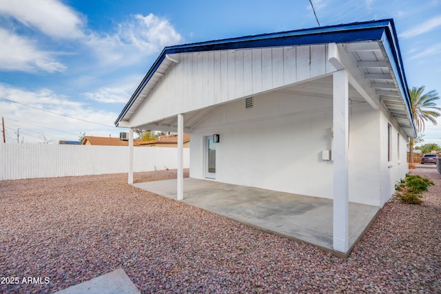 back of property with a patio area