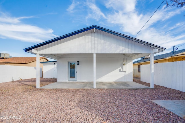 back of property with a patio area