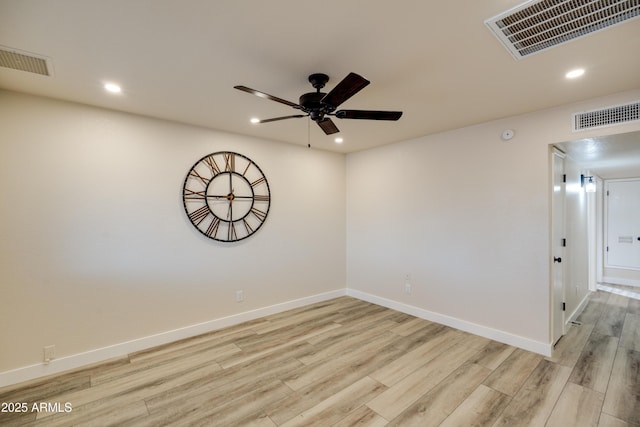 unfurnished room featuring ceiling fan and light wood-type flooring