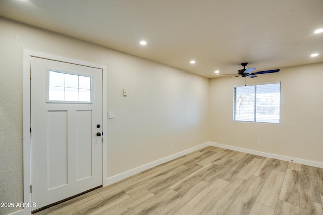 foyer featuring ceiling fan and light hardwood / wood-style floors