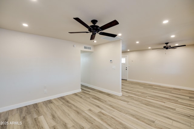 empty room with light hardwood / wood-style floors and ceiling fan