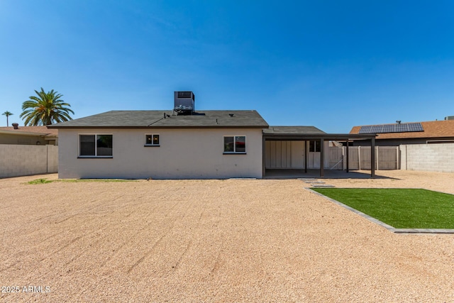 rear view of house featuring a patio area and cooling unit