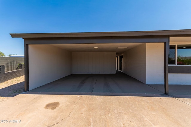 view of parking / parking lot featuring a carport