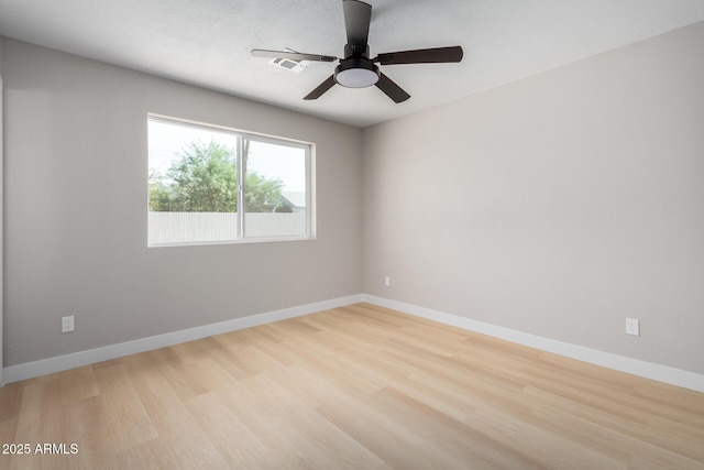 unfurnished room featuring ceiling fan and light hardwood / wood-style floors