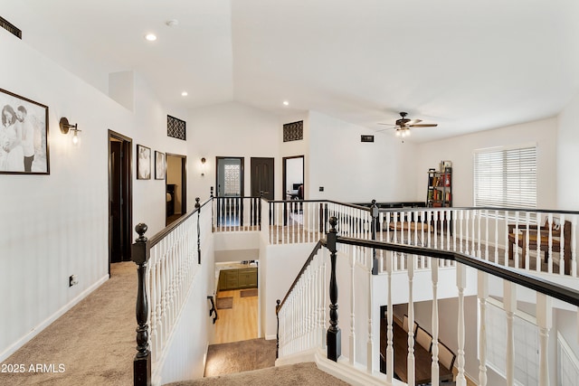 stairway with recessed lighting, baseboards, lofted ceiling, and carpet