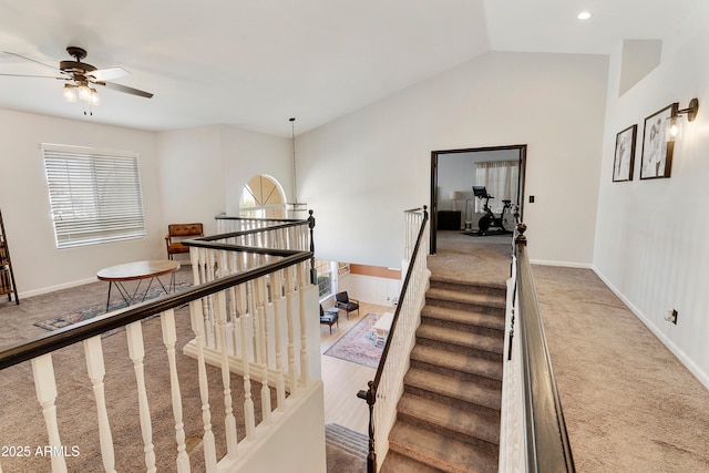 stairway with recessed lighting, baseboards, lofted ceiling, and carpet