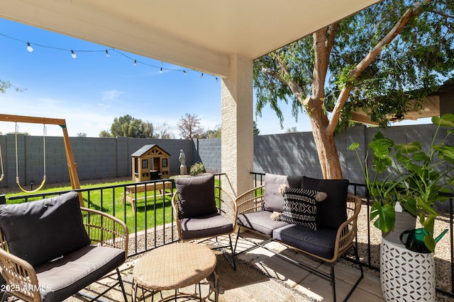 view of patio with a fenced backyard and an outdoor structure