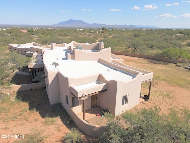 birds eye view of property featuring a mountain view