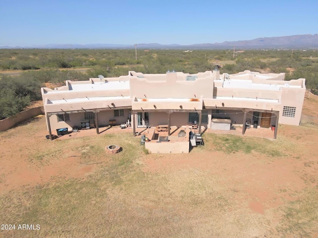 birds eye view of property featuring a mountain view