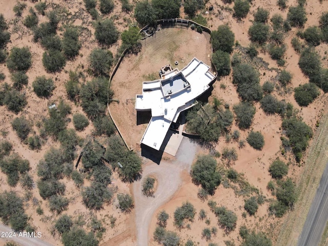 birds eye view of property with view of desert