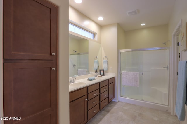 bathroom with vanity and an enclosed shower