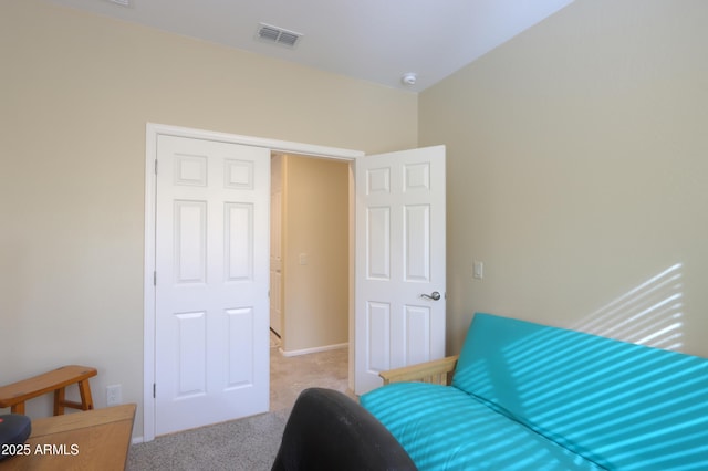 sitting room featuring light colored carpet