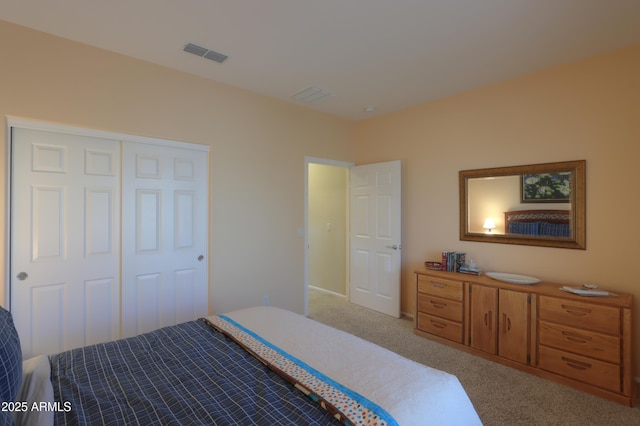 carpeted bedroom with a closet