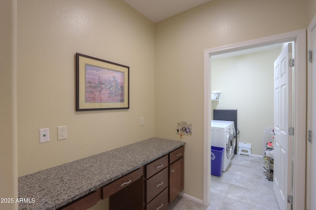 bathroom with independent washer and dryer