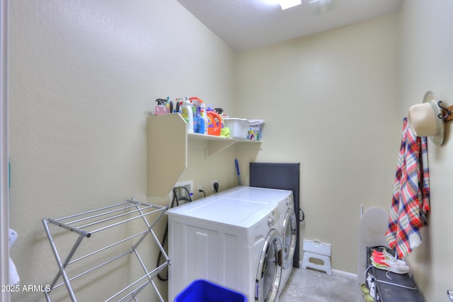 laundry area with washing machine and dryer