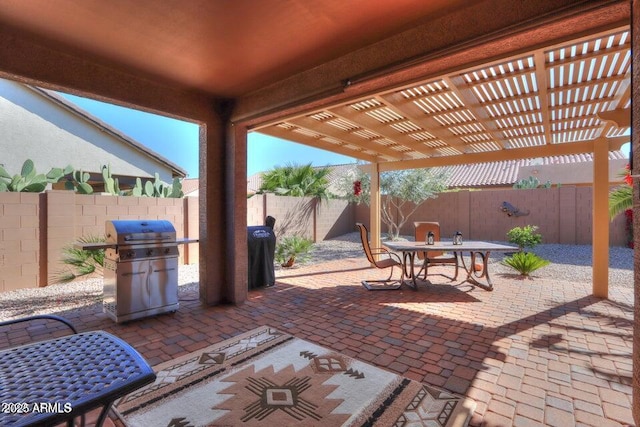 view of patio / terrace with a grill and a pergola