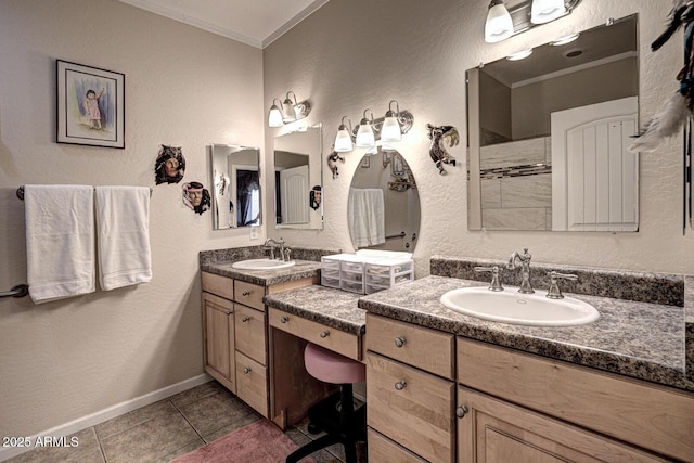 bathroom with tile patterned floors, vanity, and crown molding