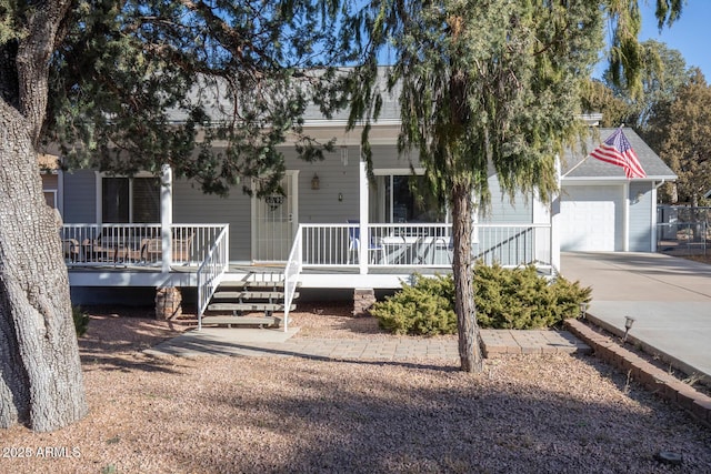 view of front of house with covered porch and a garage