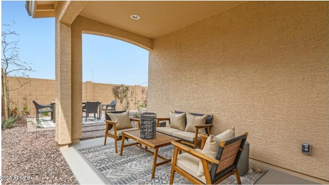 23334 W Mobile Ln, Buckeye, AZ 85326 - fenced backyard featuring a patio area and an outdoor hangout area
