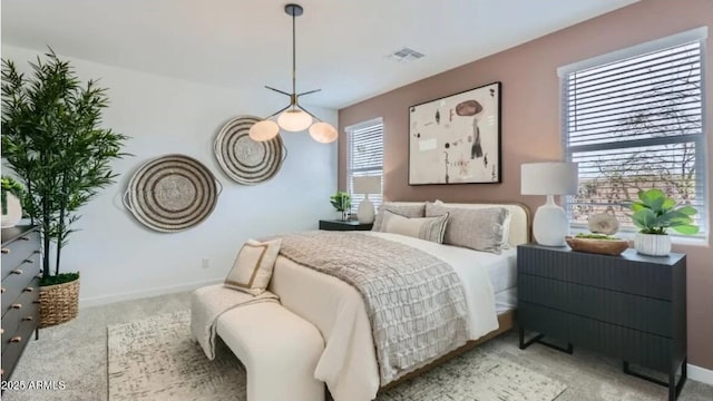 23334 W Mobile Ln, Buckeye, AZ 85326 - carpeted bedroom with multiple windows and baseboards