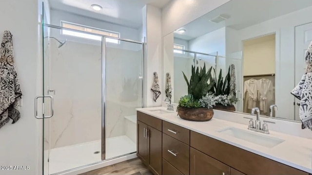 23334 W Mobile Ln, Buckeye, AZ 85326 - full bathroom featuring double vanity and a stall shower