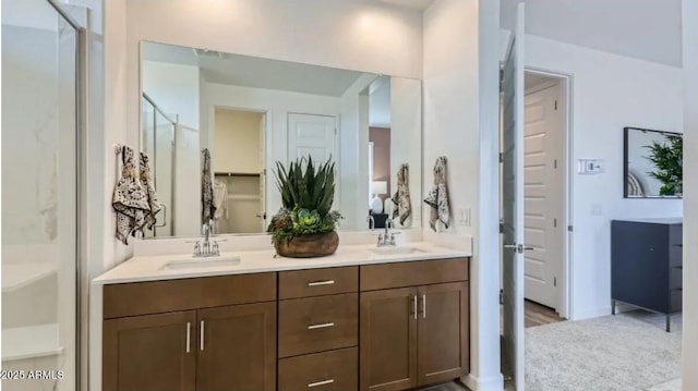 23334 W Mobile Ln, Buckeye, AZ 85326 - full bathroom with a shower stall and double vanity