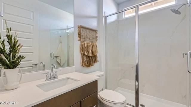 23334 W Mobile Ln, Buckeye, AZ 85326 - bathroom featuring toilet, vanity, and a marble finish shower