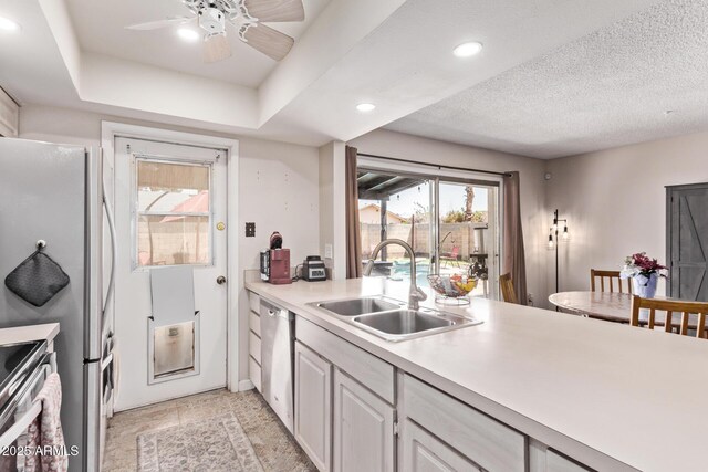 5226 W Redfield Rd, Glendale, AZ 85306 - kitchen featuring a sink, stainless steel appliances, light countertops, recessed lighting, and a ceiling fan