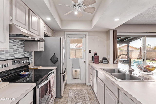 5226 W Redfield Rd, Glendale, AZ 85306 - kitchen featuring stainless steel appliances, under cabinet range hood, a sink, plenty of natural light, and recessed lighting
