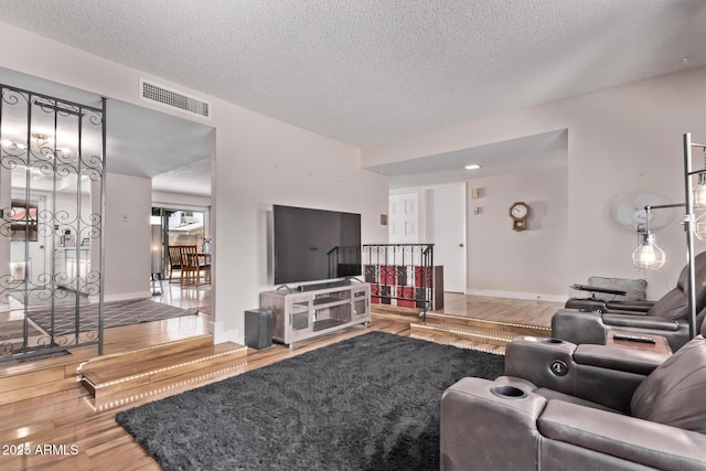 5226 W Redfield Rd, Glendale, AZ 85306 - living room featuring wood finished floors, a textured ceiling, and baseboards