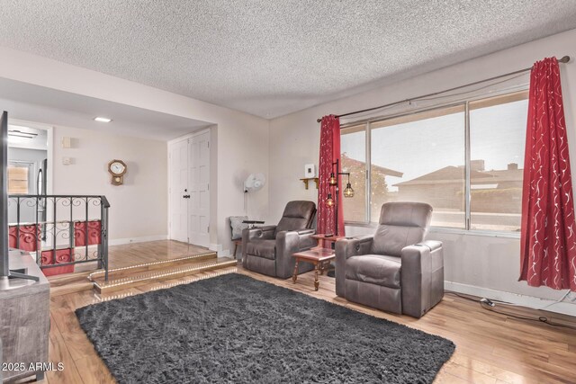 5226 W Redfield Rd, Glendale, AZ 85306 - living room featuring wood finished floors, a textured ceiling, and baseboards