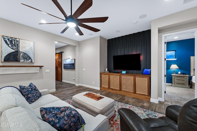 living area with recessed lighting, baseboards, ceiling fan, and wood finished floors