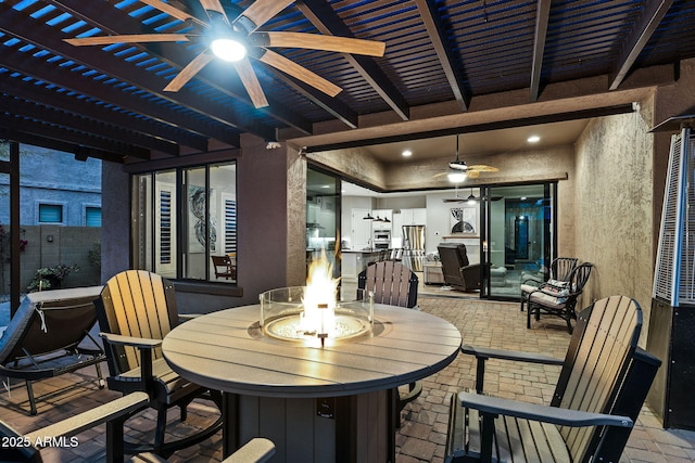 view of patio featuring a fire pit, ceiling fan, and a pergola