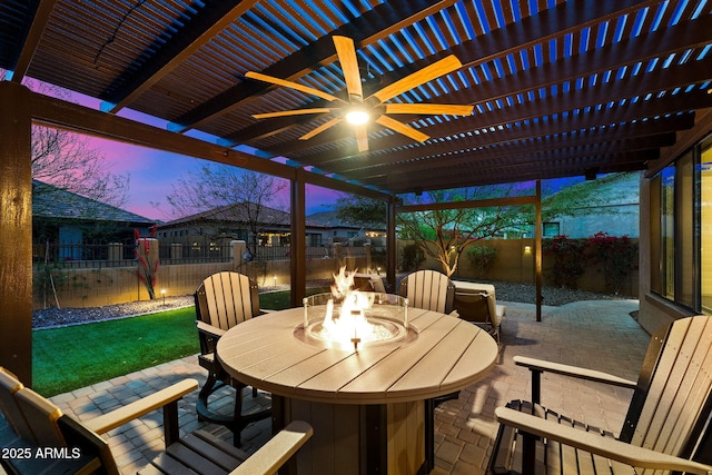 view of patio featuring an outdoor fire pit, a fenced backyard, and a pergola