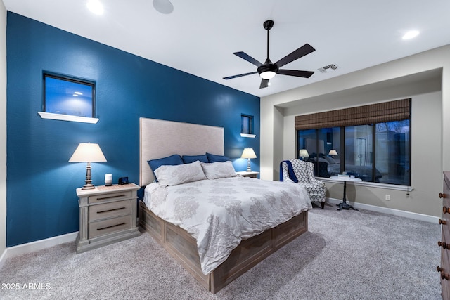 bedroom with visible vents, baseboards, ceiling fan, and carpet flooring