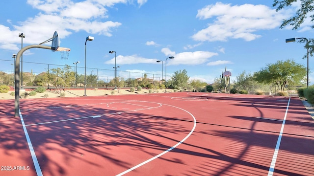 view of basketball court featuring community basketball court and fence