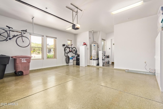 garage with gas water heater, baseboards, and a garage door opener