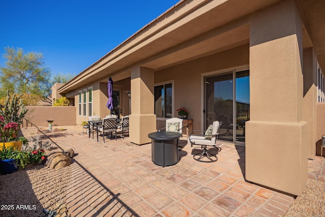 view of patio featuring fence