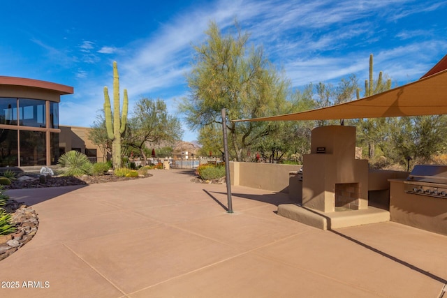 view of patio featuring area for grilling and exterior kitchen