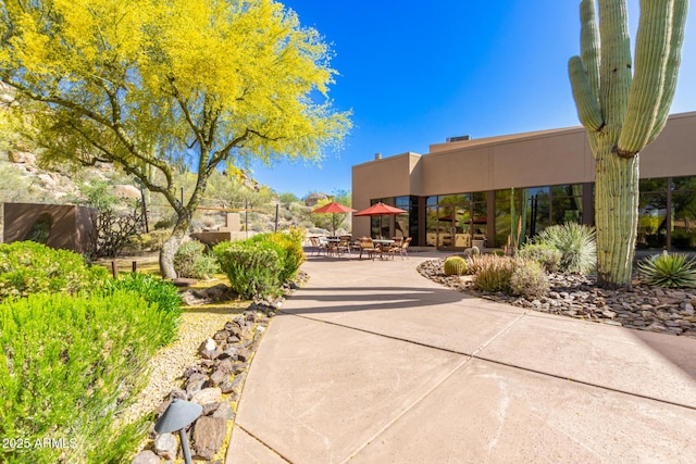 view of home's community featuring a patio area