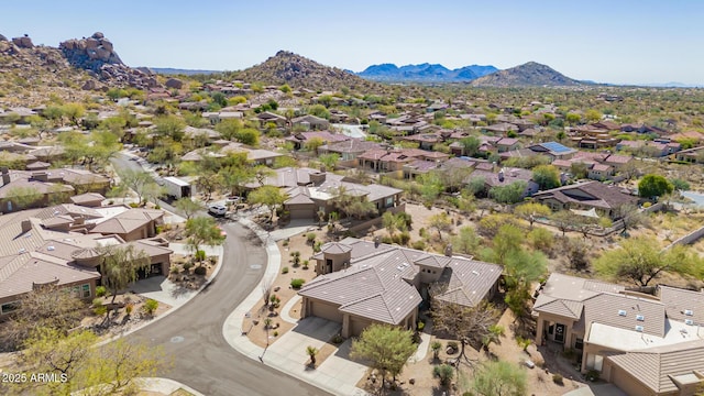 drone / aerial view featuring a residential view and a mountain view