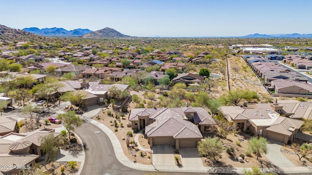 drone / aerial view featuring a mountain view and a residential view