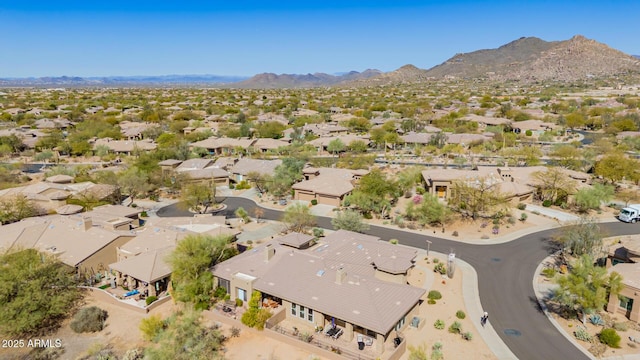 birds eye view of property featuring a mountain view and a residential view